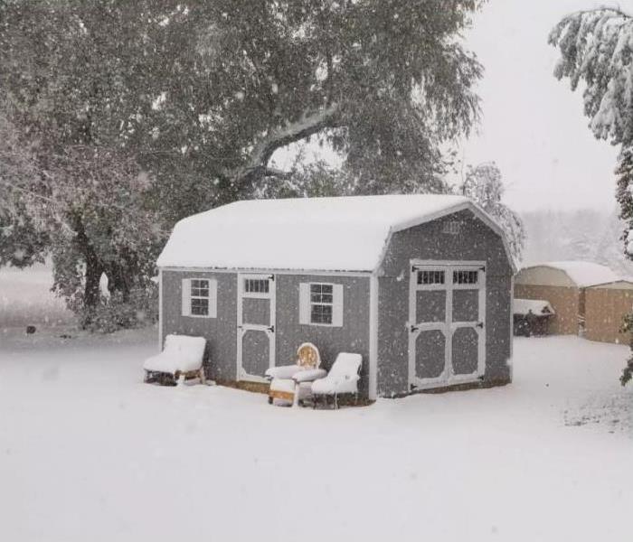 shed covered in snow